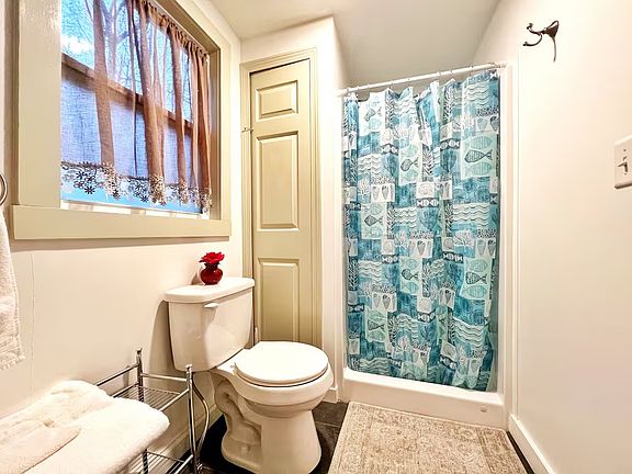 The bathroom has a shower.