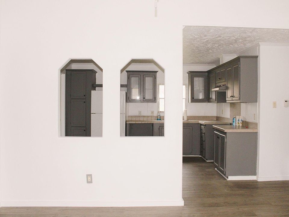Living room overseeing the kitchen and dining room area