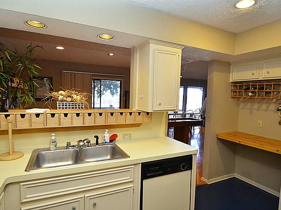 Going into the living areas is a built in desk and even a place for wine storage!