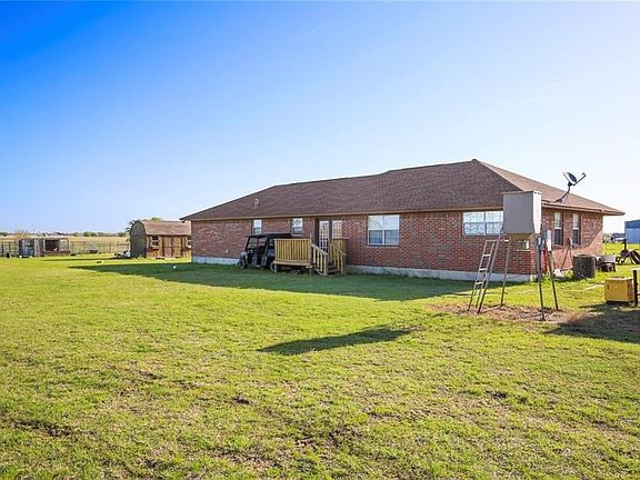 This is a back view of the largest home, shows the deck off of the back of the house.