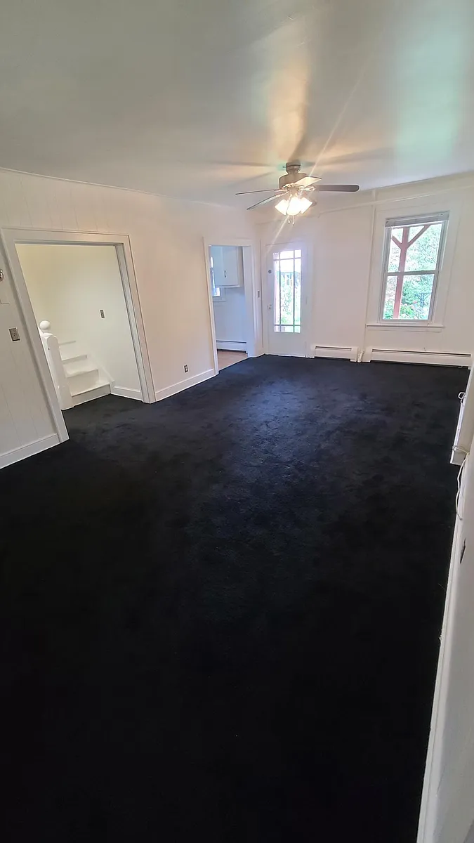 Living room/dining room opposite angle facing the front entrance. - 3 Cedar St #3L