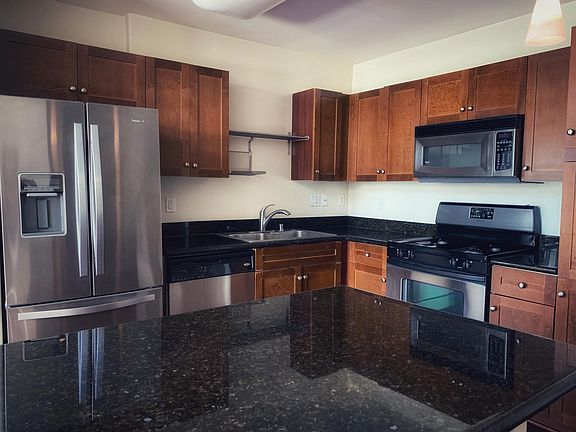 Granite counters. Stainless steel appliances. Euro-style cabinets.