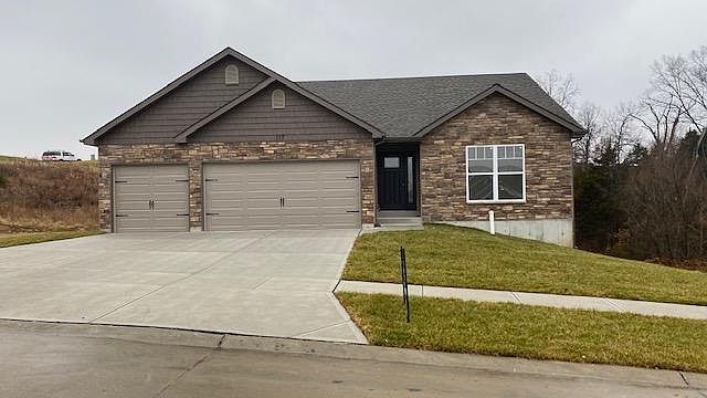 Three Car Garage and stone front
