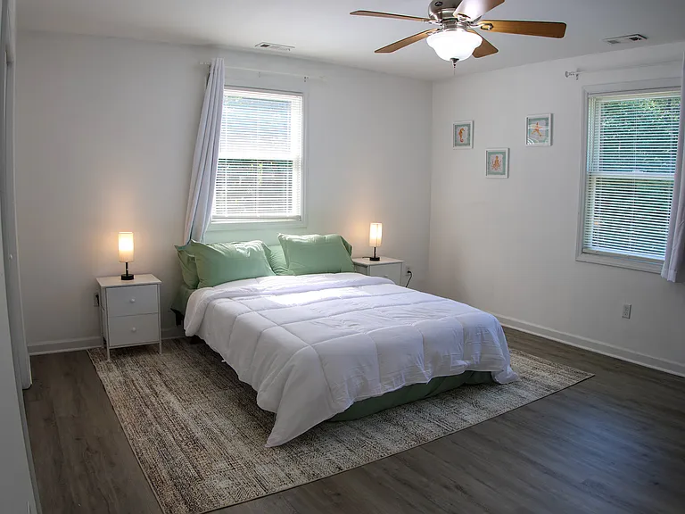 Bedroom 5, 2nd floor primary bedroom with private on suite bathroom and Roku TV. Queen size bed.