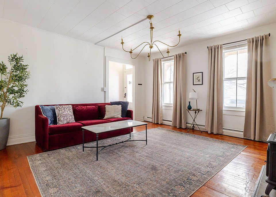Living Room Facing Street Windows and Entry Hall
