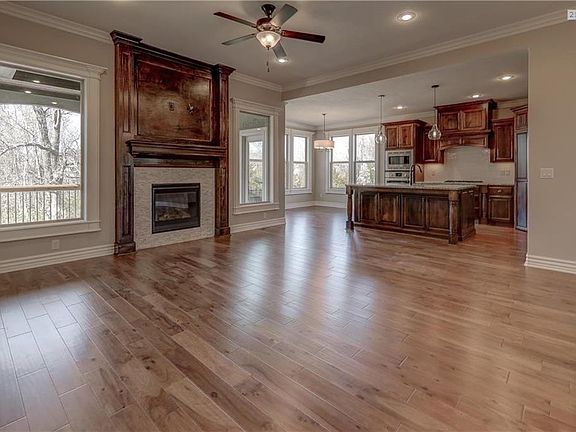 Gorgeous stone fireplace with custom wood trim and mantle.