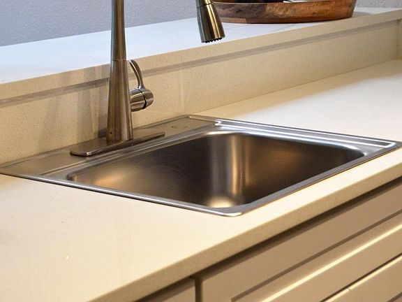Stainless sink overlooks bar