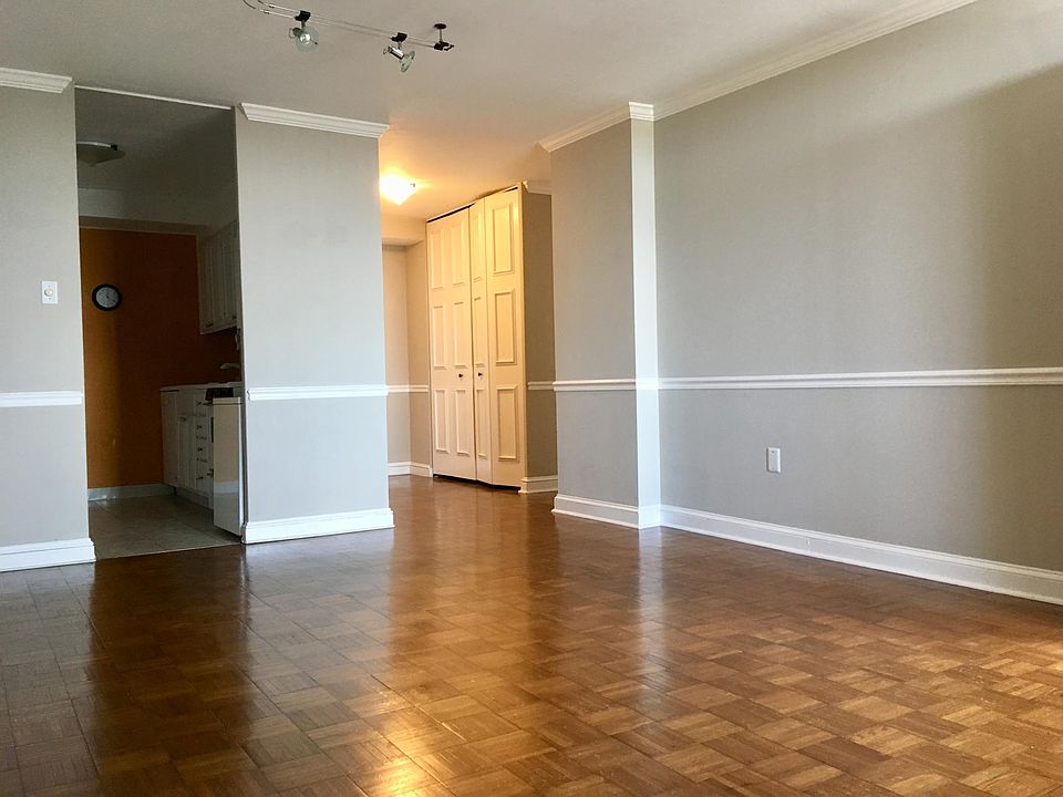 View of entryway and kitchen from living room area