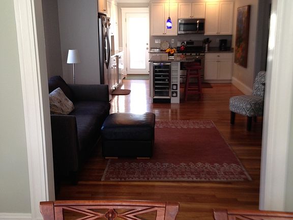 The living room and dining room flow into the kitchen in an