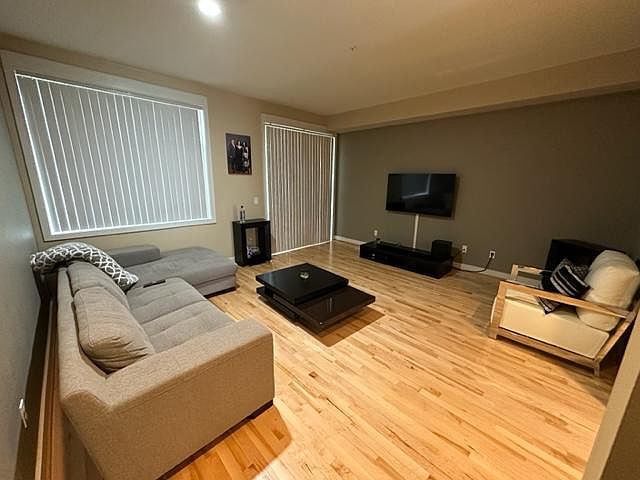 Living room area with back deck access
