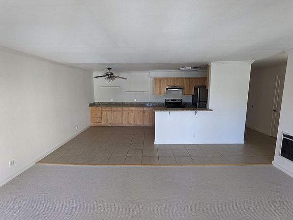 Eating area adjacent to the kitchen flows to large living room.