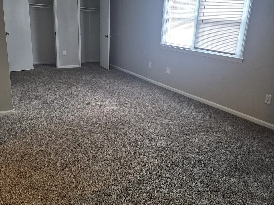 Large living area with double closet space.