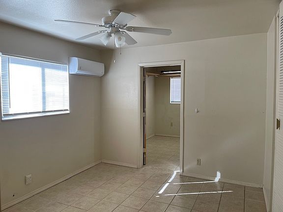 Primary bedroom with view into bonus room
