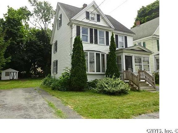 Exterior Front. Notice the double wide drive way and shed!