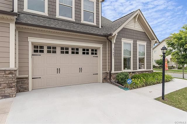 Front View. Desirable End Unit with 1.5 Car Garage