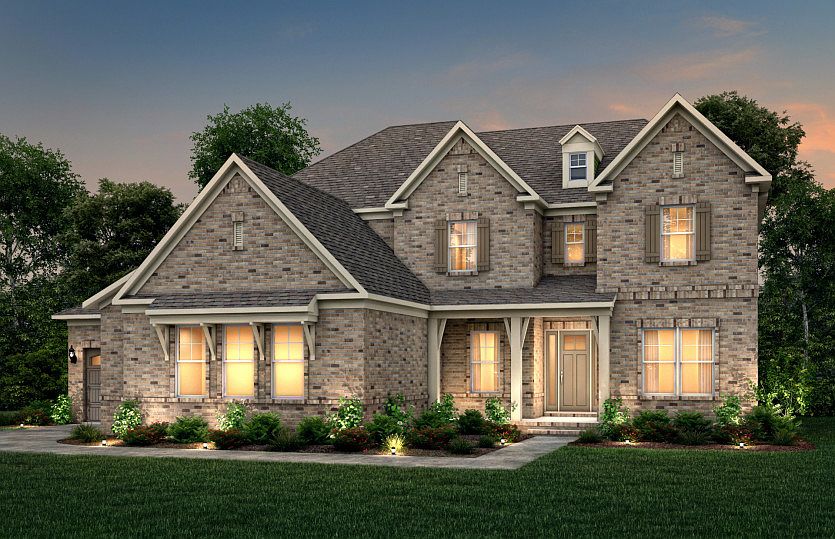 Hampton Exterior 18 features brick, covered front porch and 3 car sideload garage