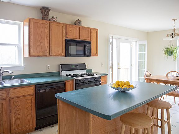 Bright kitchen leads to deck