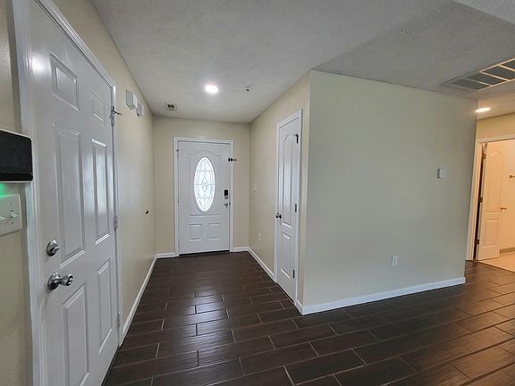Foyer closet. Garage door.