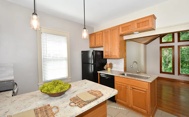 Single bowl stainless sink overlooks back room with huge windows. - 1723 Queen St