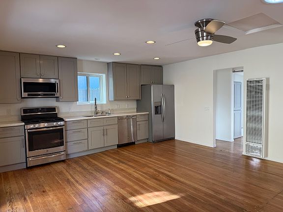Open living area with kitchen.