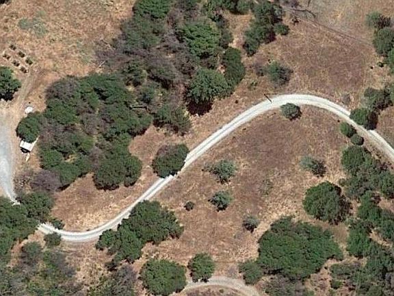 This shows private drive to the home. 7 acres.