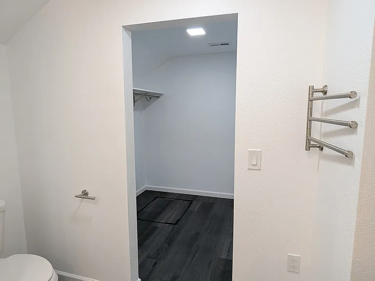 Plenty of towel racks and hooks. No awkward space heaters taking up wall space.