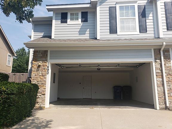 Front of house - Garage open