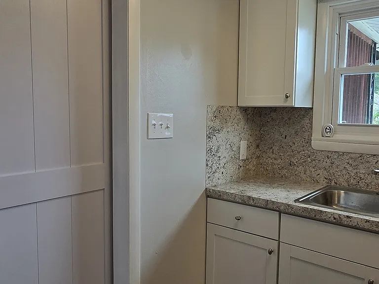 New barn door that leads into bathroom