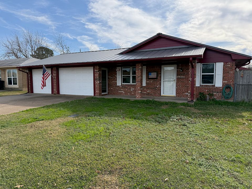 Large covered front porch and 2 car garage