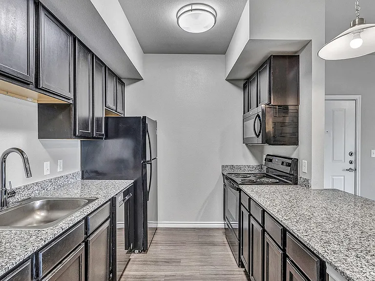 Enjoy granite countertops, stainless steel farm sinks, and black appliances