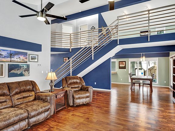 Open floor plan with spacious vaulted ceilings