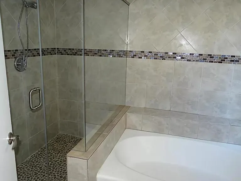 Updated frameless shower and Garden Tub