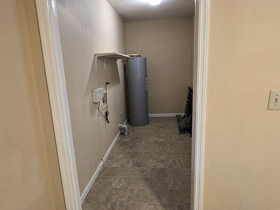laundry room . carport entry door is on right side