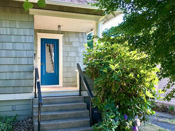 Front entry on NW 62nd St with beautifully refinished fir flooring & new paint.