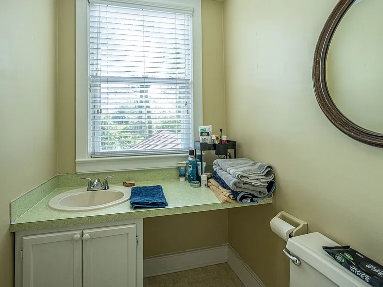 Half bath opens from inside the main bedroom upstairs.