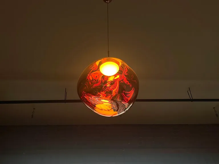 Living area Tom Dixon "Melt" pendant lighting installed in 2022