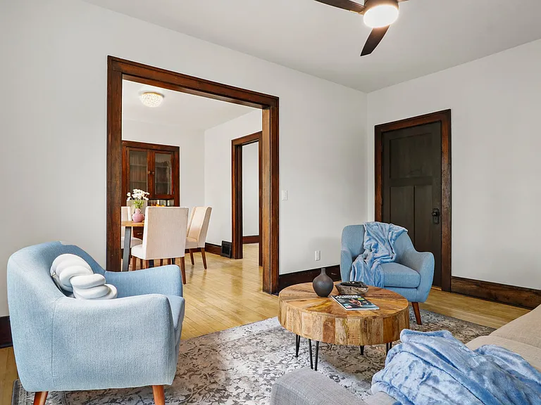 See that door over there? That leads to a large bathroom with plenty of storage. You can see the dining area to the left and an open doorway to a lovely bedroom.