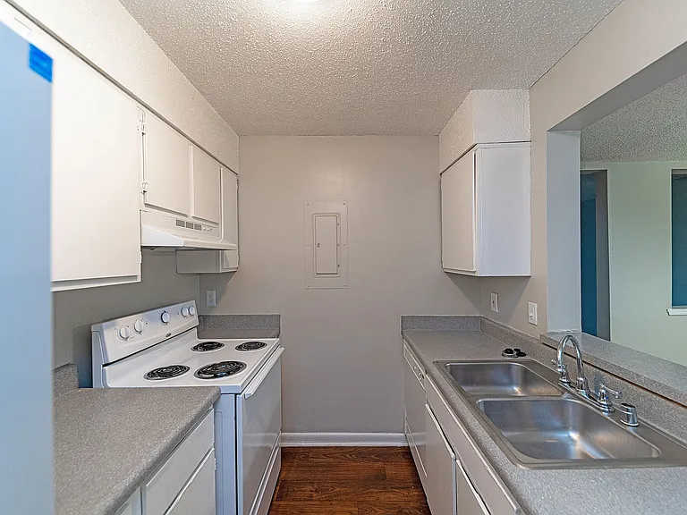 Fully equipped kitchen with generous counter space & cabinetry