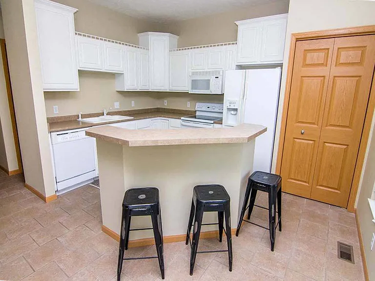 Functional kitchen islands add extra seating and space for gathering.
