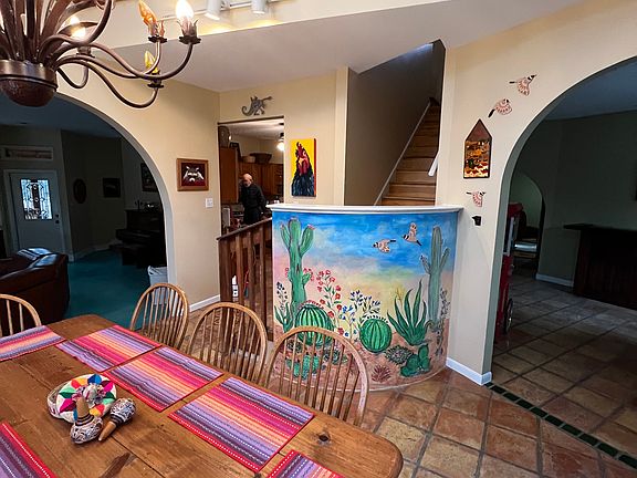 upstairs loft with three bedrooms and two bath upstairs and two bedrooms and two bathrooms downstairs living room to the left and den to the right