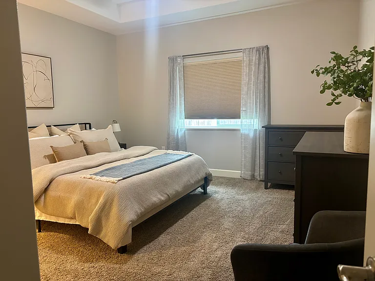 Primary suite is large, faces the back yard for quiet and privacy, and features a California King (sleep number)
