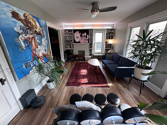 Living Room _ Built-in library included; furniture, books, and other items shown are for display only (unit is rented unfurnished)