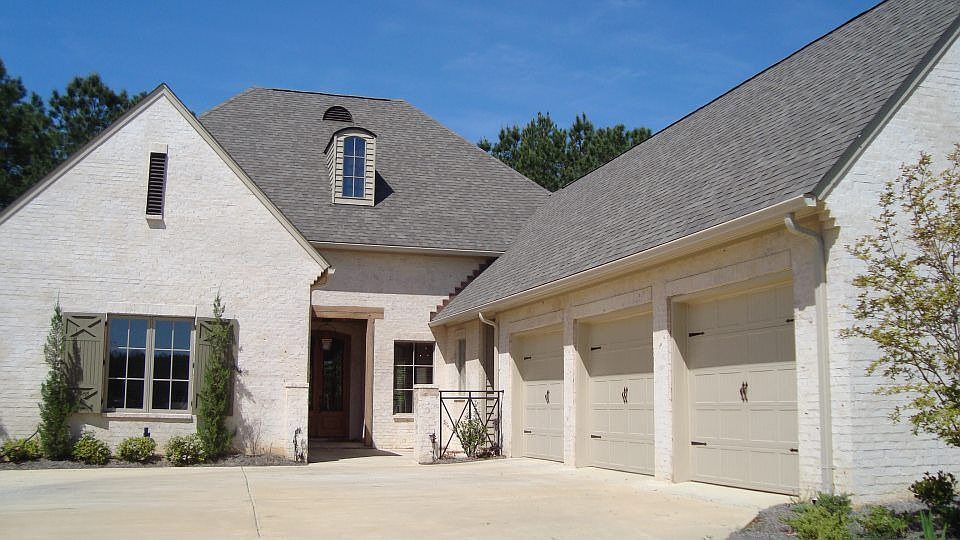 Main entrance, 3 car garage, low maintenance yard