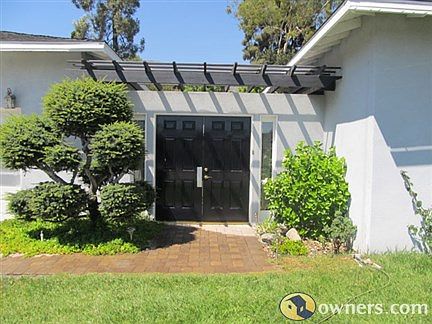 Double door entrance into personal courtyard oasis