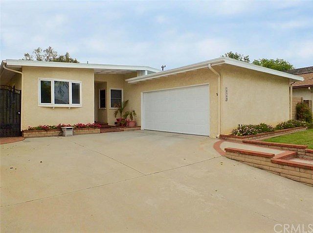 Large driveway with 2 car attached garage
