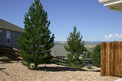 Left of the house is a open area that leads down to a park in the rear of house