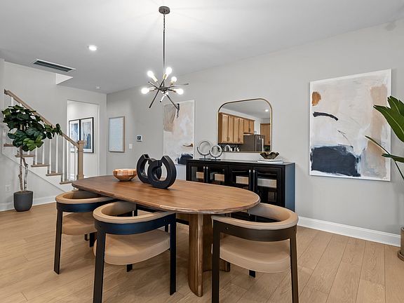 Ample dining area with elevated ceiling and premium finishes in The Adaline new townhome by DRB Home