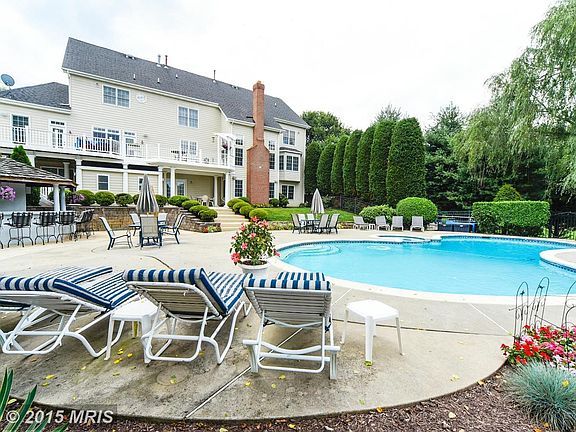 Sparkling in-ground pool with covered grill/bar