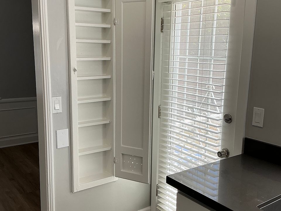 Maximized storage space for spices that served as an iron board back in the day... retro!