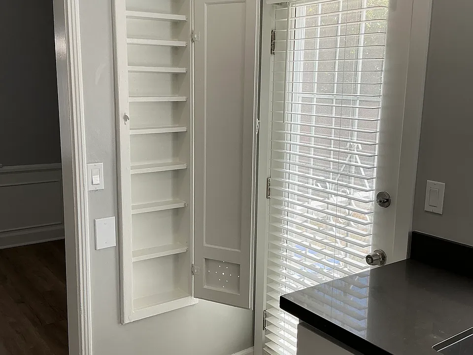 Maximized storage space for spices that served as an iron board back in the day... retro!